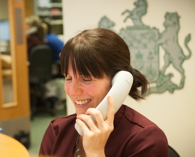 receptionist smiling on phone