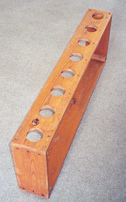 wooden stand with holes